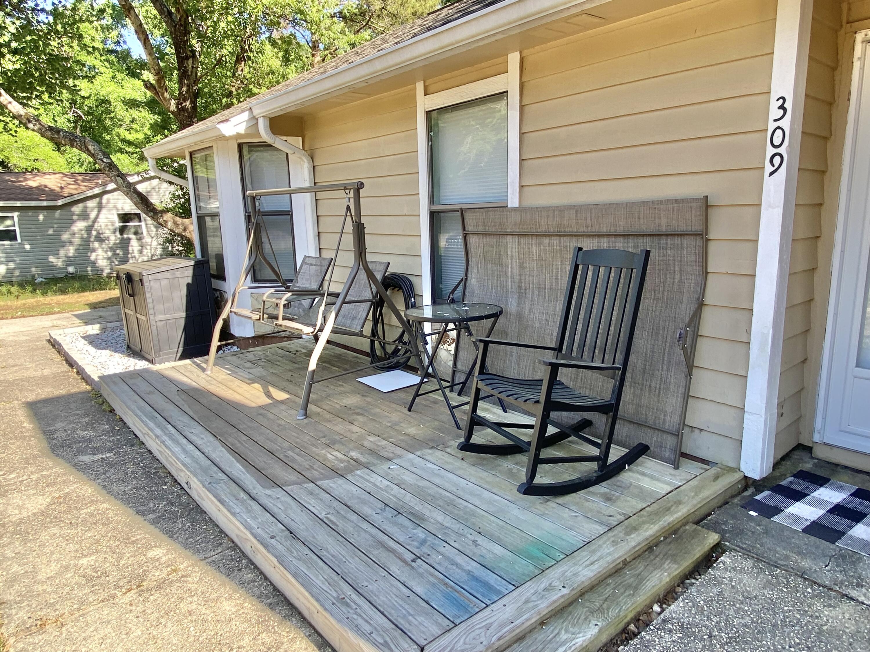 309 Springwood Circle Crestview, FL 32536 - Photo 5 of 44 a view of a two chairs in the balcony