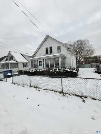 a house with a tree in front of it