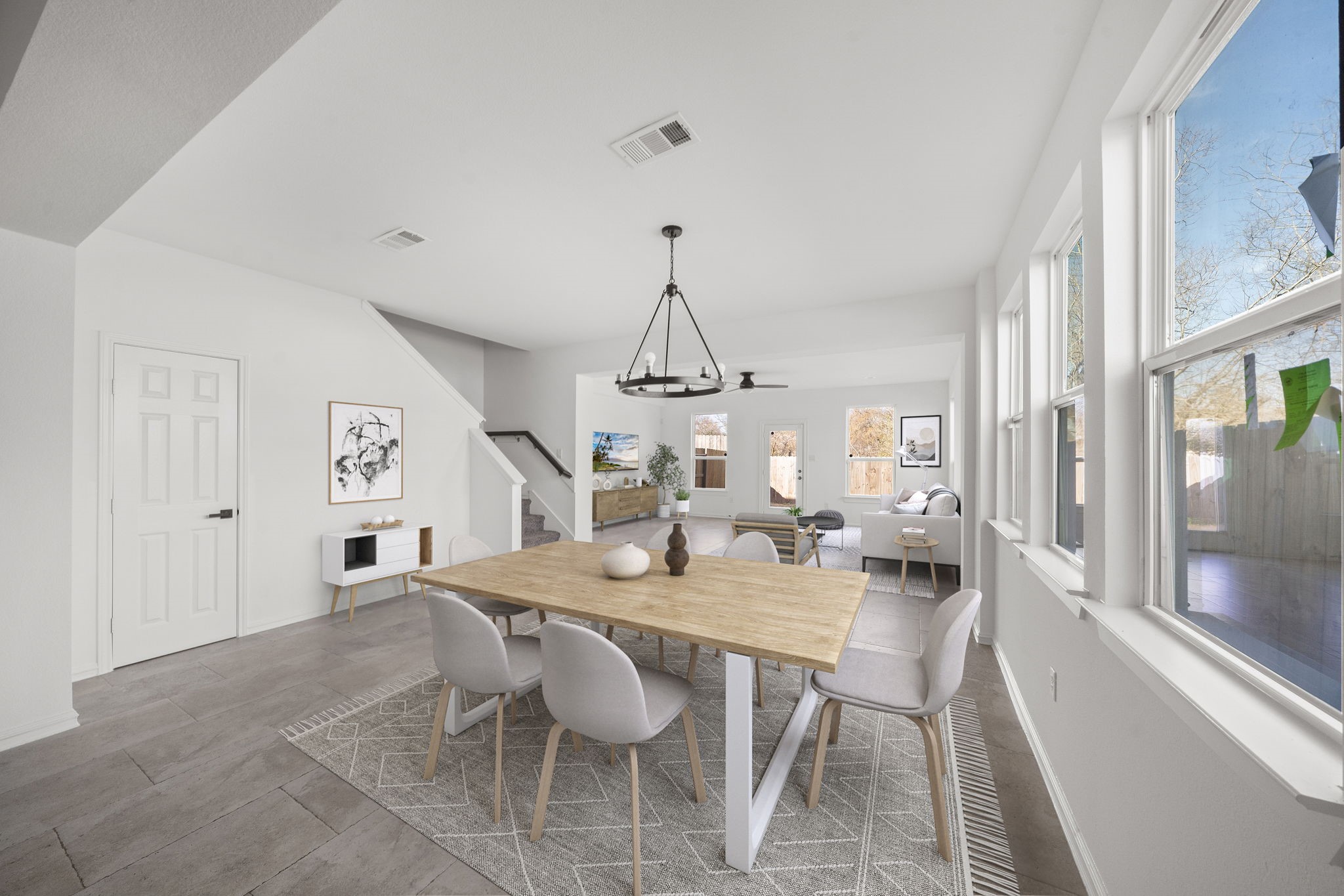 2019 Harlem Street Houston, TX 77020 - Photo 1 of 37 a dining room with wooden floor a chandelier a wooden table and chairs