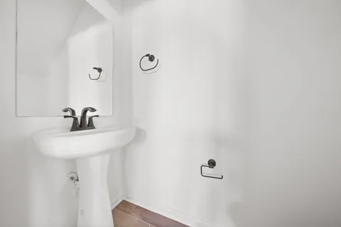 a bathroom with a sink and mirror