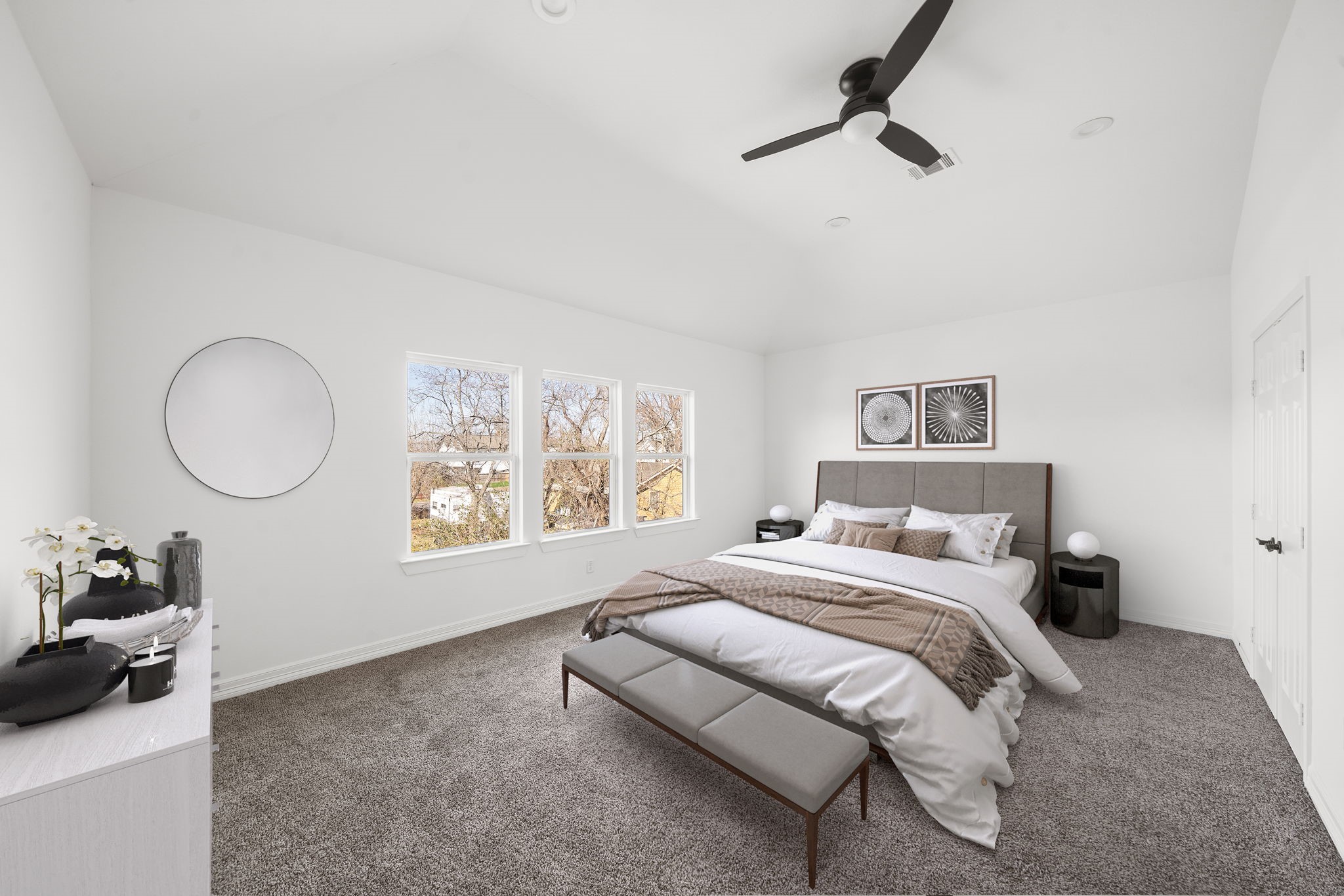 2019 Harlem Street Houston, TX 77020 - Photo 20 of 37 a bedroom with a bed a dresser and windows