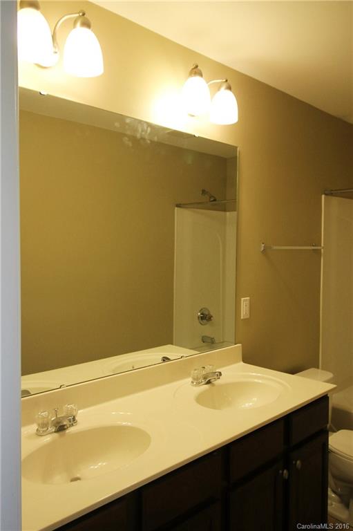 242 River Clay Road, Unit UNTI 202 Fort Mill, SC 29708 - Photo 15 of 18 a bathroom with a sink and a mirror
