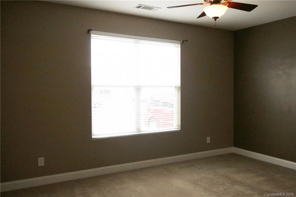 242 River Clay Road, Unit UNTI 202 Fort Mill, SC 29708 - Photo 7 of 18 an empty room with a window