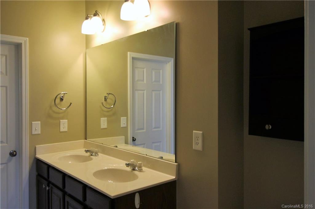 242 River Clay Road, Unit UNTI 202 Fort Mill, SC 29708 - Photo 8 of 18 a bathroom with a sink and a mirror