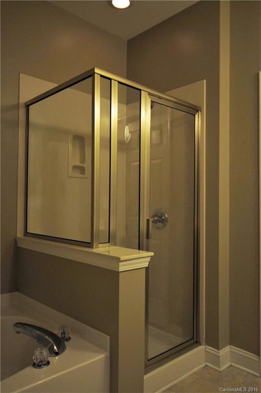 242 River Clay Road, Unit UNTI 202 Fort Mill, SC 29708 - Photo 10 of 18 a bathroom with a sink a toilet and shower