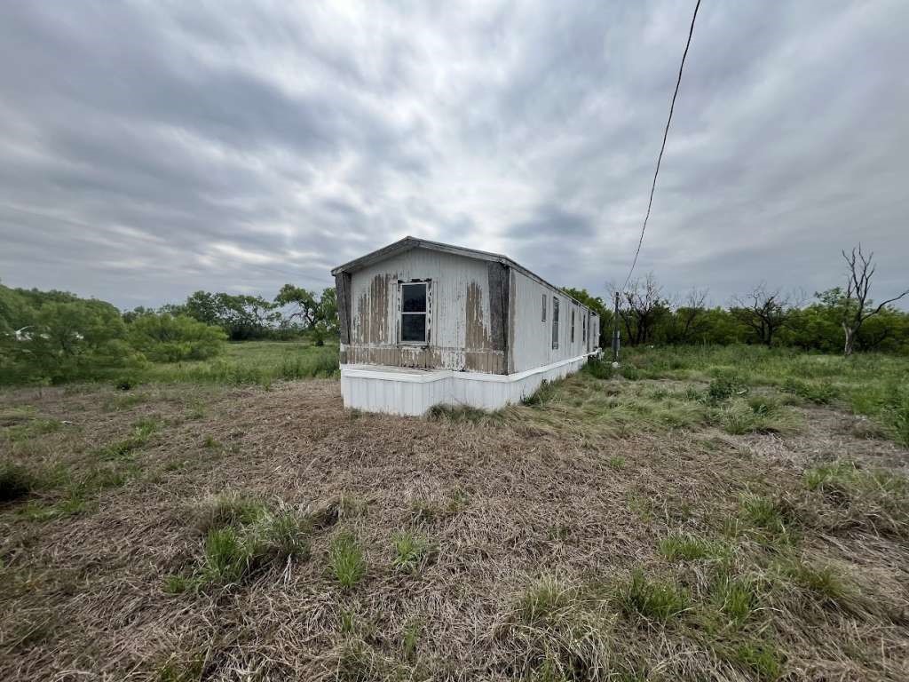 12942 McFall Road Iowa Park, TX 76367 - Photo 3 of 5 a view of backyard of house