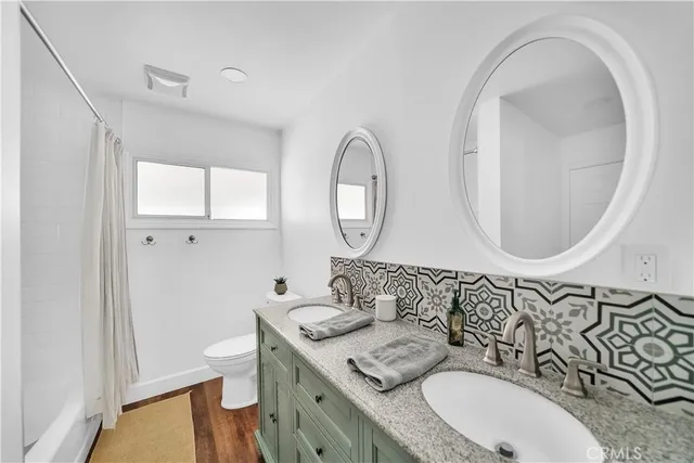 a bedroom with furniture and baby crib