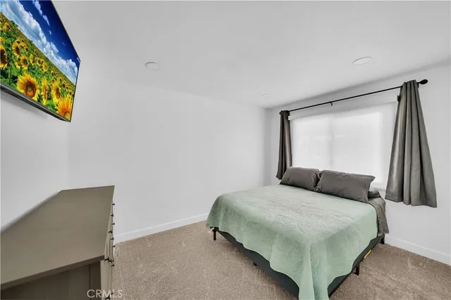 a view of a workspace with furniture and wooden floor