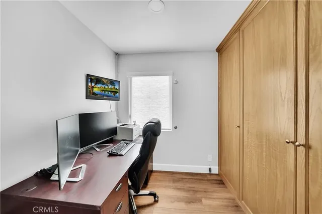an empty room with furniture and a fireplace