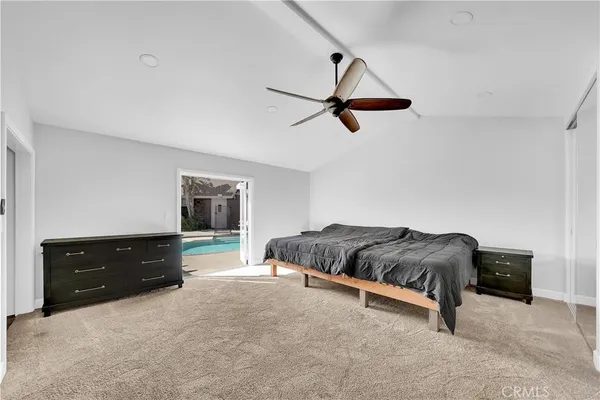 a view of walk in closet with clothes