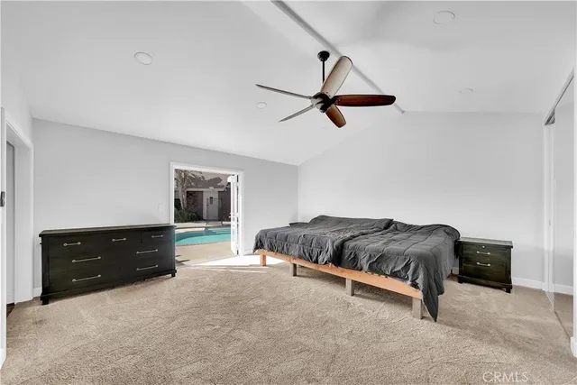 a view of walk in closet with clothes