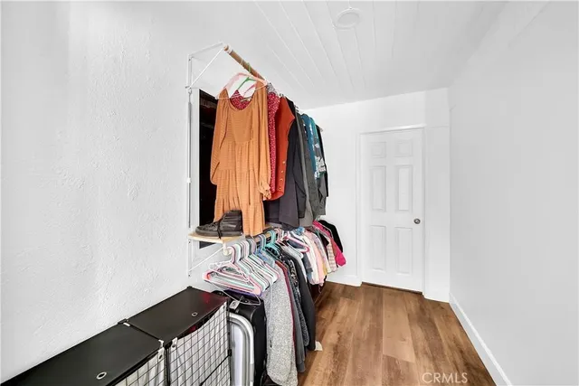 a spacious bathroom with a granite countertop sink and a mirror
