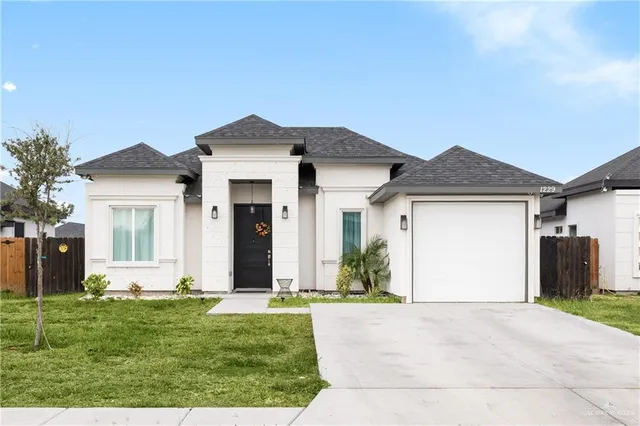 front view of a house with a yard