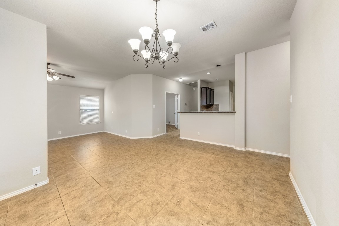 1811 Conn Creek Road Cedar Park, TX 78613 - Photo 12 of 33 a view of a big room with windows and chandelier