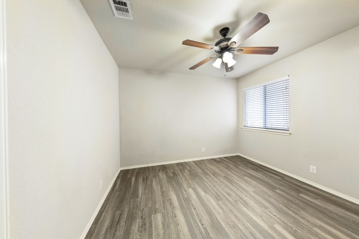 1811 Conn Creek Road Cedar Park, TX 78613 - Photo 16 of 33 an empty room with a window and a fan