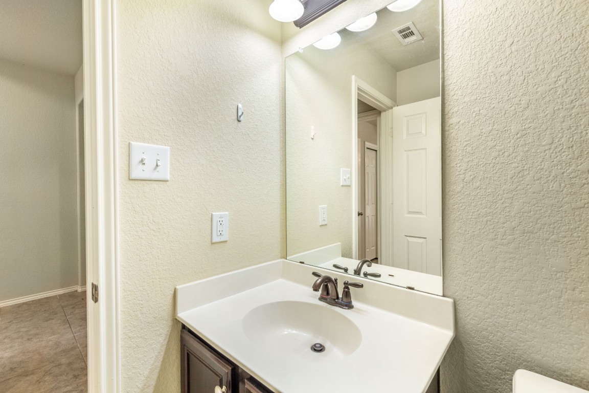 1811 Conn Creek Road Cedar Park, TX 78613 - Photo 19 of 33 a bathroom with a sink and a mirror