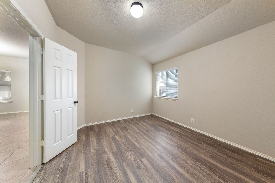 1811 Conn Creek Road Cedar Park, TX 78613 - Photo 21 of 33 wooden floor in an empty room with a window