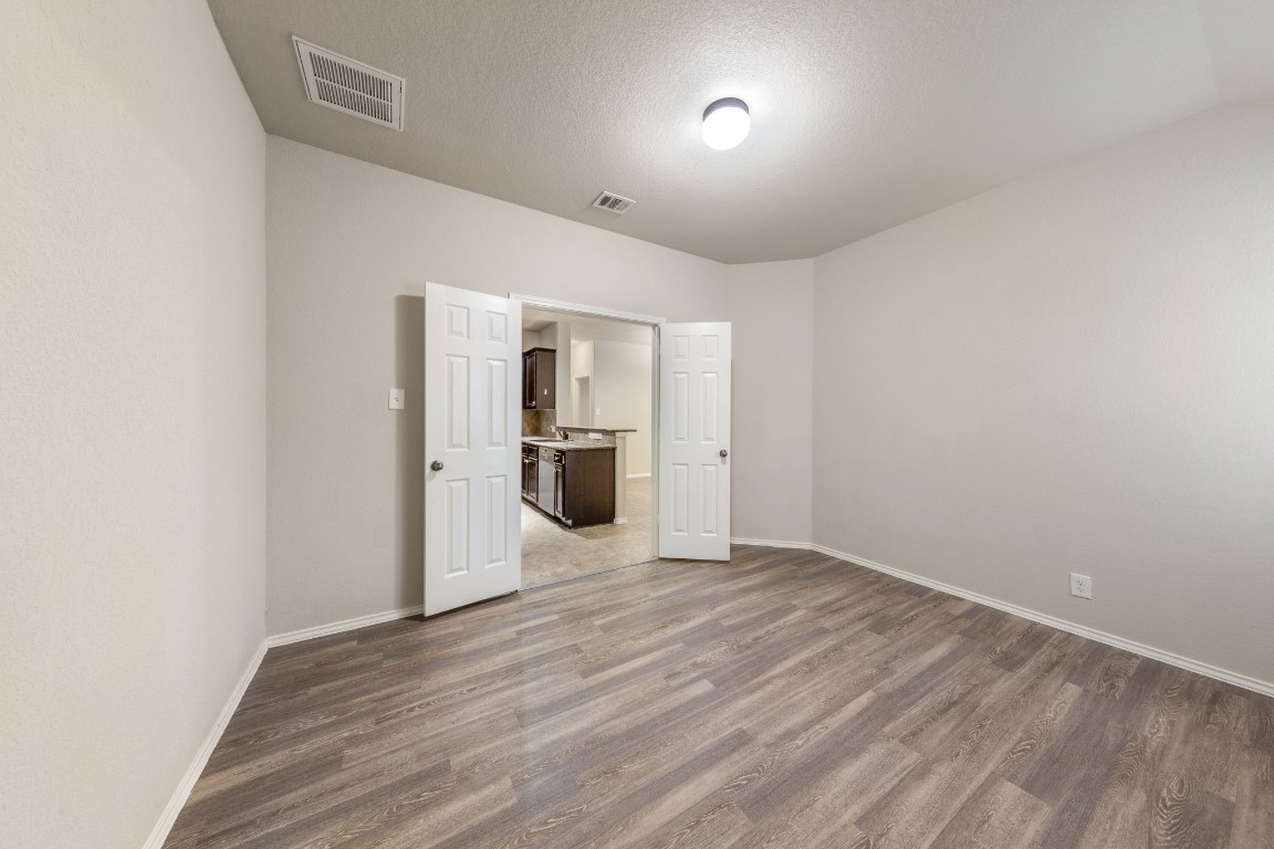 1811 Conn Creek Road Cedar Park, TX 78613 - Photo 22 of 33 a view of a kitchen with a sink and a refrigerator