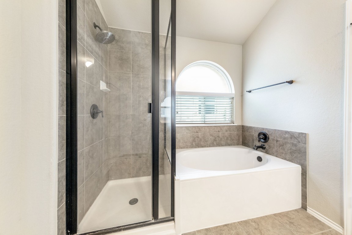 1811 Conn Creek Road Cedar Park, TX 78613 - Photo 26 of 33 a white bath tub sitting next to a shower