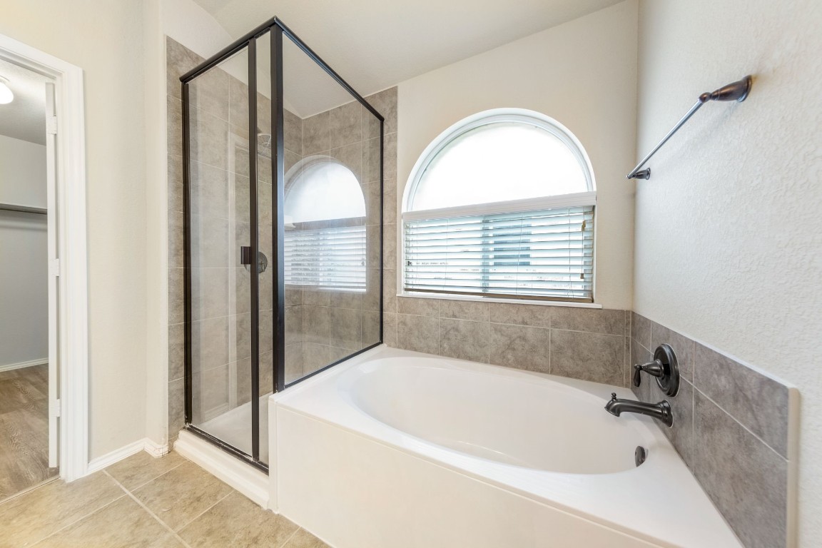 1811 Conn Creek Road Cedar Park, TX 78613 - Photo 27 of 33 a bathroom with a bathtub and a shower