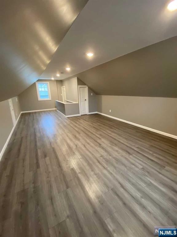 79 East Ridgewood Avenue Paramus, NJ 07652 - Photo 17 of 31 an empty room with wooden floor and windows