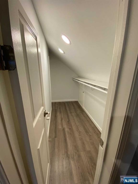 79 East Ridgewood Avenue Paramus, NJ 07652 - Photo 18 of 31 a view of a hallway with wooden floor