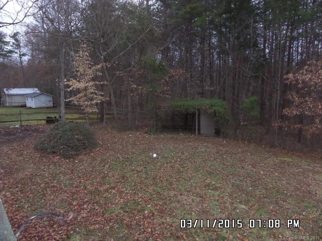 293 Sailwinds Road Mooresville, NC 28115 - Photo 15 of 15 a backyard of a house with lots of green space
