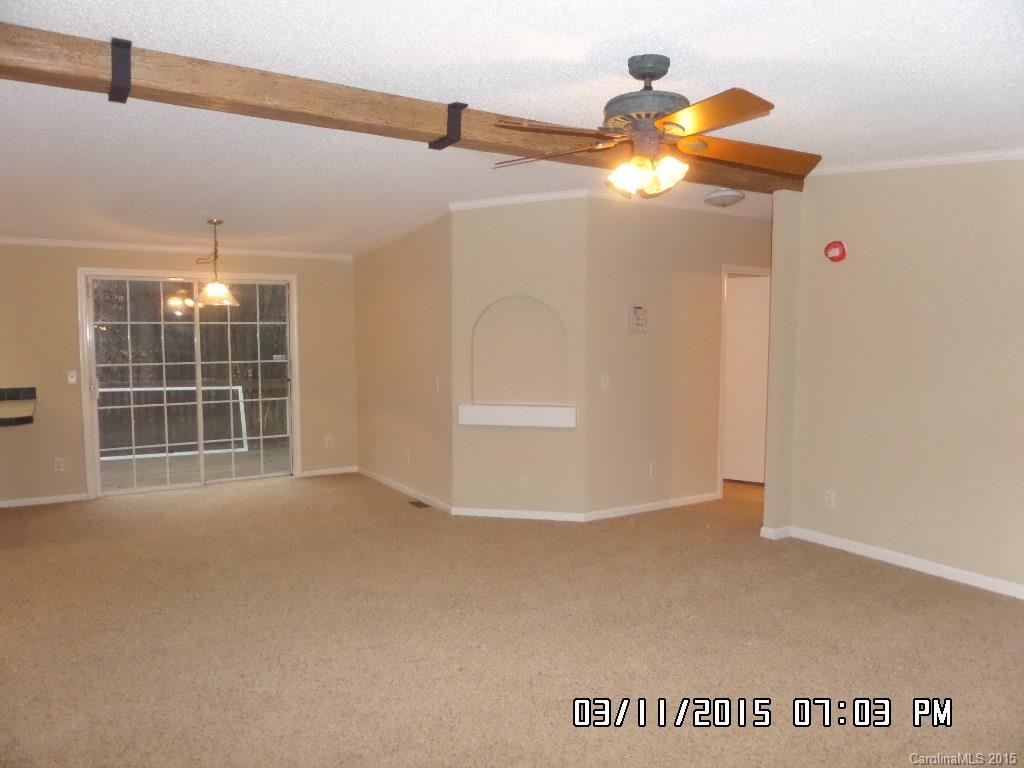 293 Sailwinds Road Mooresville, NC 28115 - Photo 3 of 15 a view of an empty room with a window