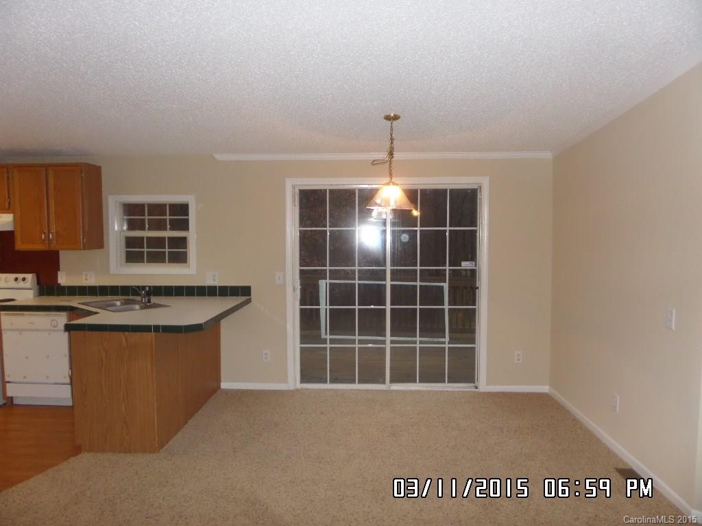 293 Sailwinds Road Mooresville, NC 28115 - Photo 4 of 15 a view of kitchen with granite countertop sink and cabinets