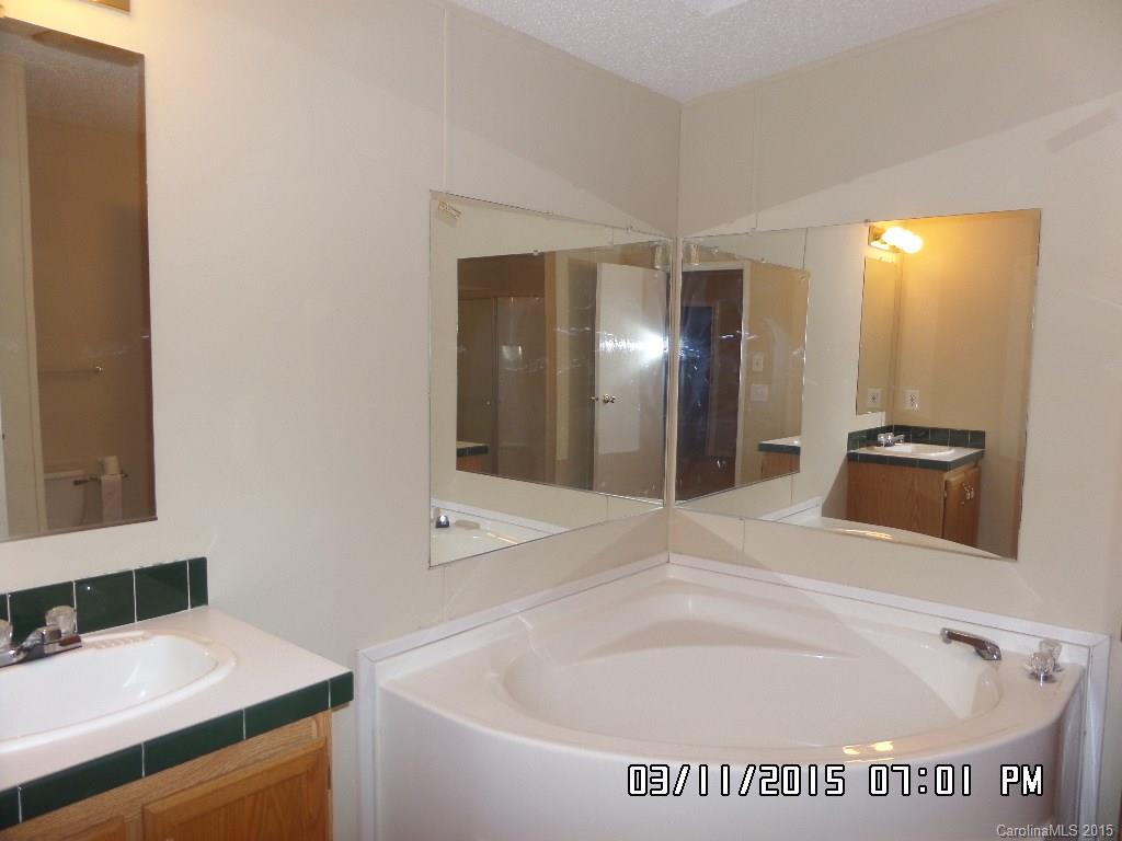 293 Sailwinds Road Mooresville, NC 28115 - Photo 9 of 15 a bathroom with a tub and a sink