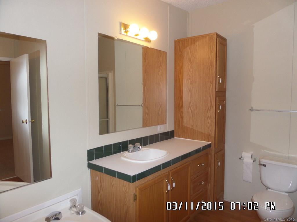 293 Sailwinds Road Mooresville, NC 28115 - Photo 10 of 15 a bathroom with a sink and a mirror