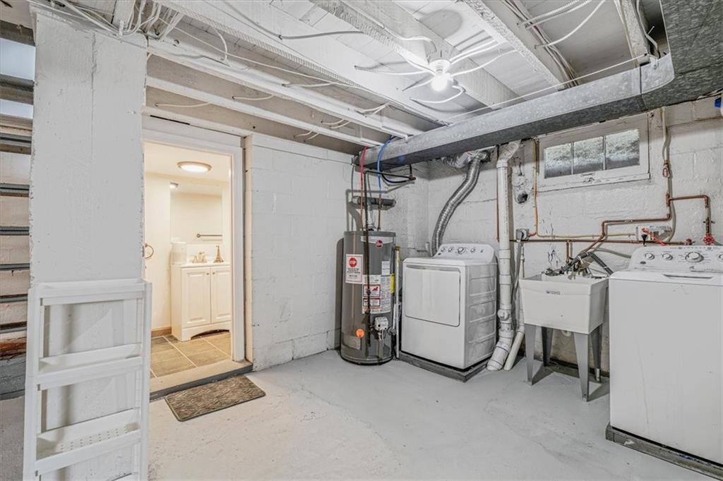 559 Boquet Street Carnegie, PA 15106 - Photo 15 of 20 a view of a storage & utility room with dryer and washer