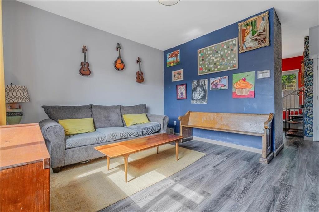 559 Boquet Street Carnegie, PA 15106 - Photo 5 of 20 a bedroom with furniture and a wooden floor