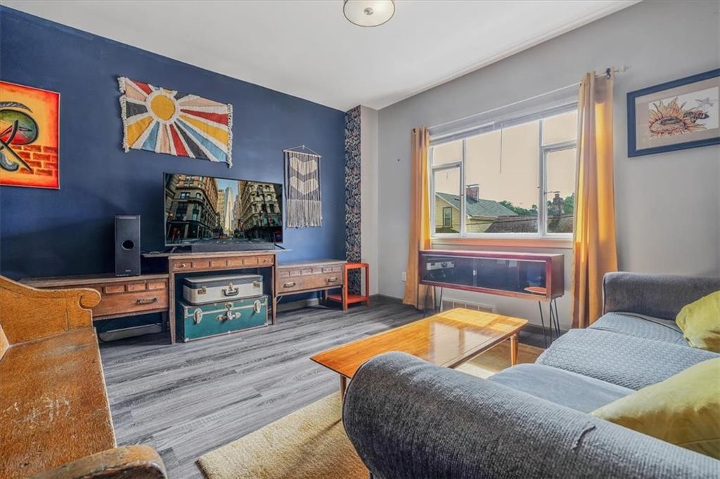 559 Boquet Street Carnegie, PA 15106 - Photo 6 of 20 a living room with furniture and a flat screen tv