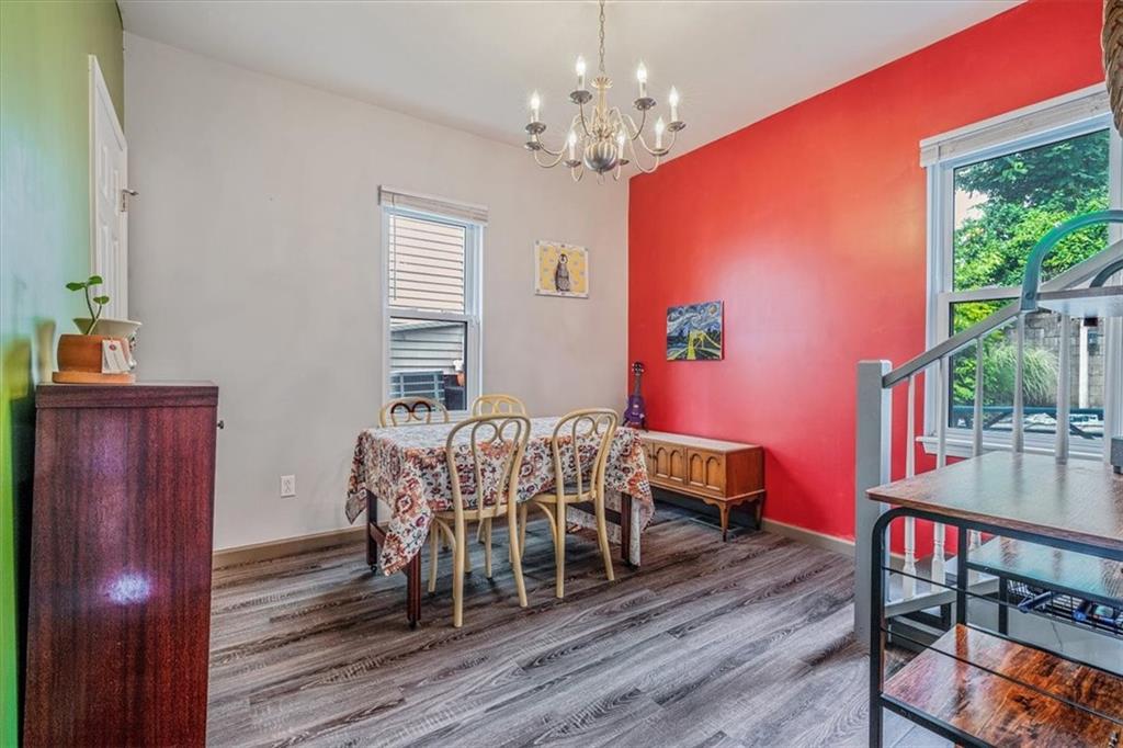 559 Boquet Street Carnegie, PA 15106 - Photo 7 of 20 a dining room with furniture a chandelier and wooden floor