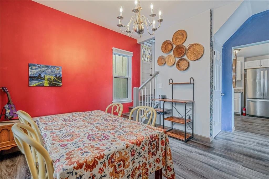 559 Boquet Street Carnegie, PA 15106 - Photo 8 of 20 a bedroom with a bed a dresser and chair