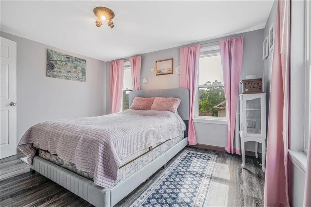 559 Boquet Street Carnegie, PA 15106 - Photo 9 of 20 a bedroom with a bed lamp and a large window