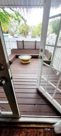 a view of balcony with furniture