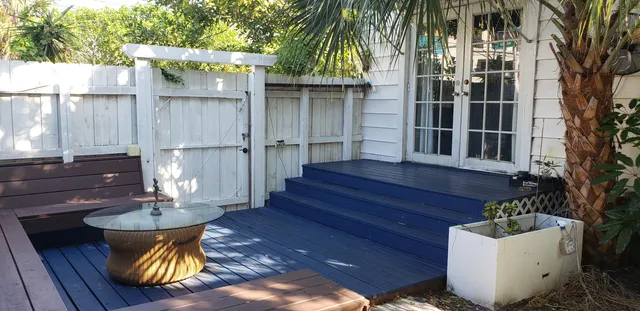 a view of a chairs and table in the patio