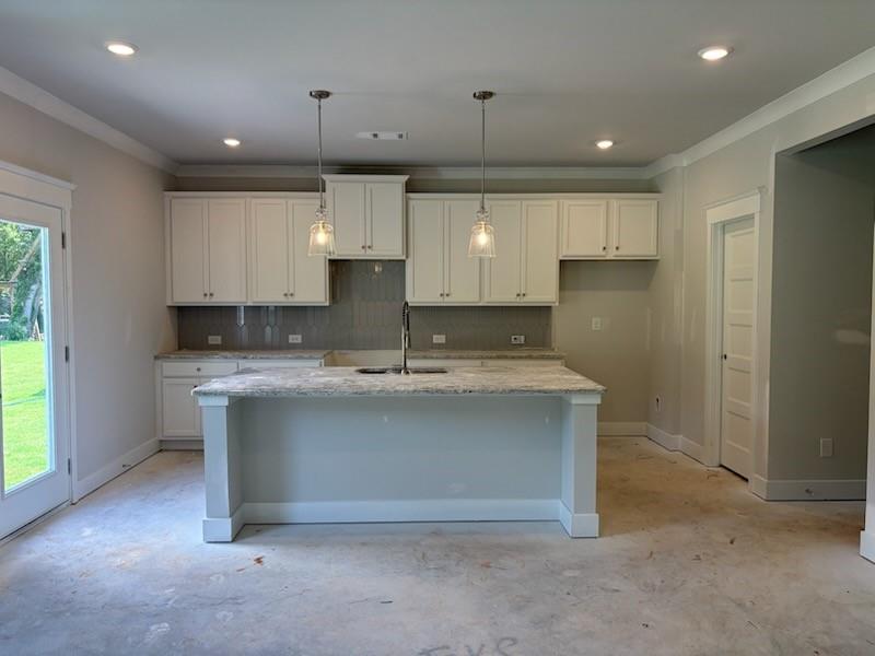 6 Commons Way Cartersville, GA 30120 - Photo 6 of 37 a view of kitchen with granite countertop a sink and dishwasher a refrigerator with wooden cabinets