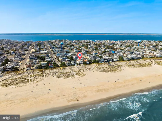a front view of a residential apartment building with a yard