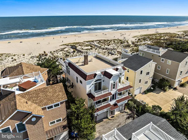 a kitchen with stainless steel appliances granite countertop a stove and living room view