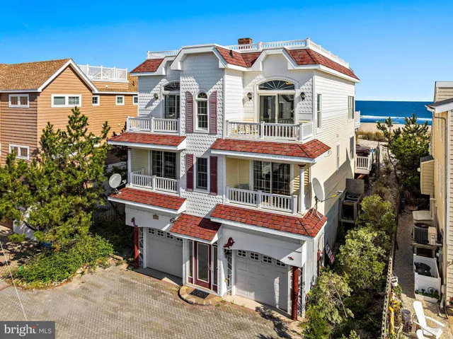 a living room with furniture a flat screen tv and a large window