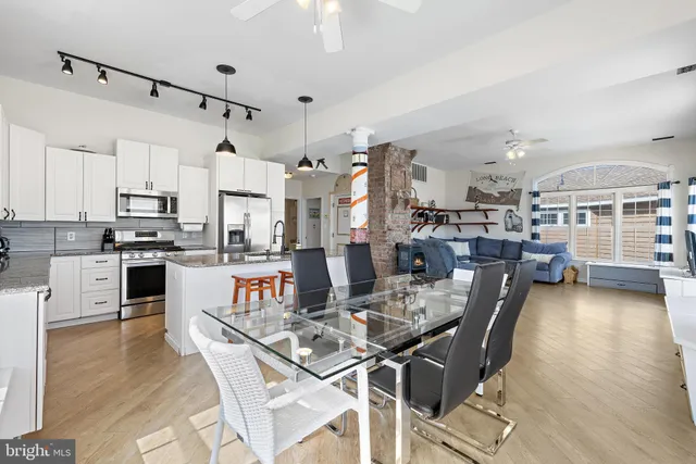 a view of a balcony with chairs and a potted plant