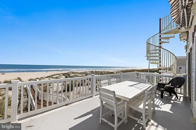 a view of a kitchen with a sink and microwave