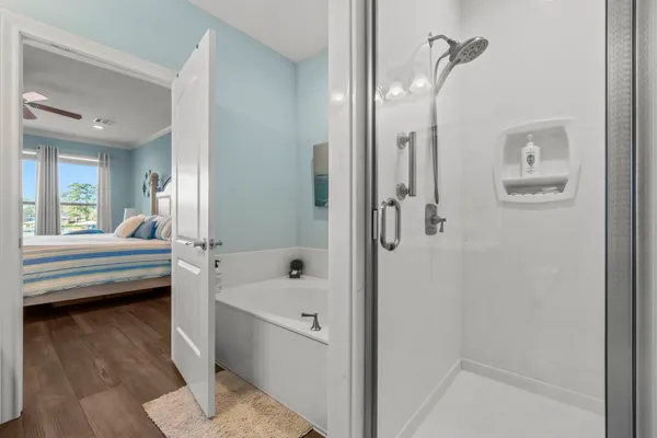 a bathroom with a bathtub and shower