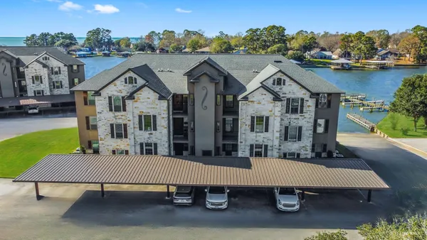 a view of a house with pool table and chairs