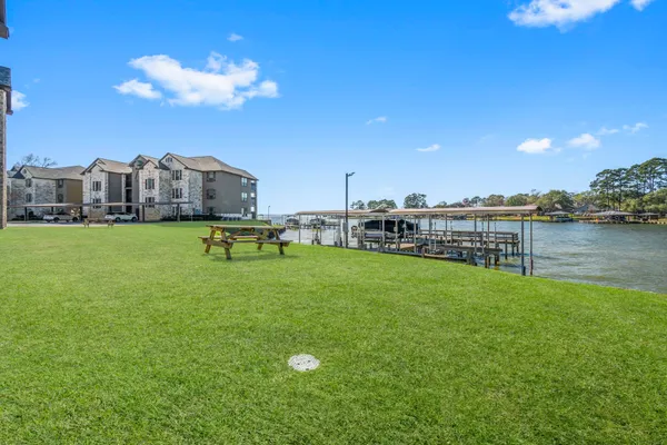a view of a lake with a big yard