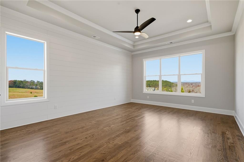 5364 Price Road Gainesville, GA 30506 - Photo 33 of 59 a view of an empty room with wooden floor and a window