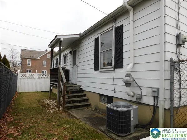 a front view of a house with stairs